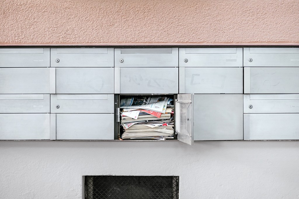 spam property marketing mail in a mailbox