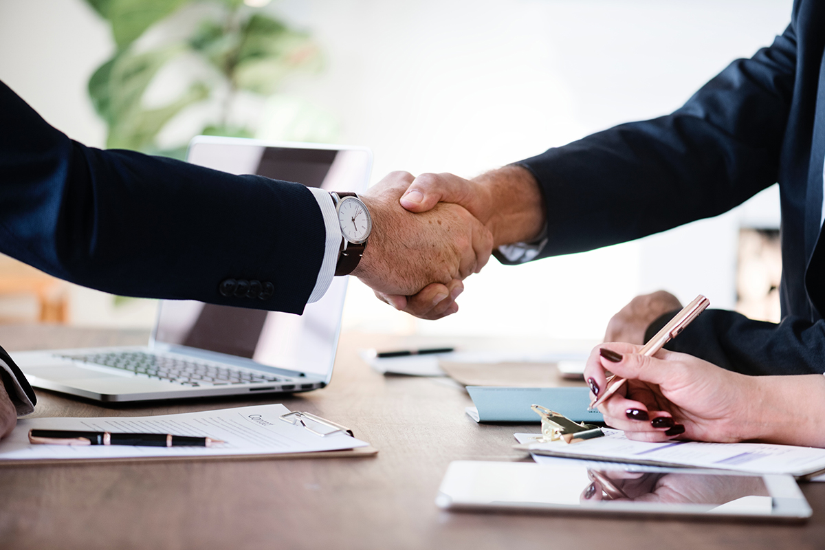 property manager and renters shaking hands about property management laws