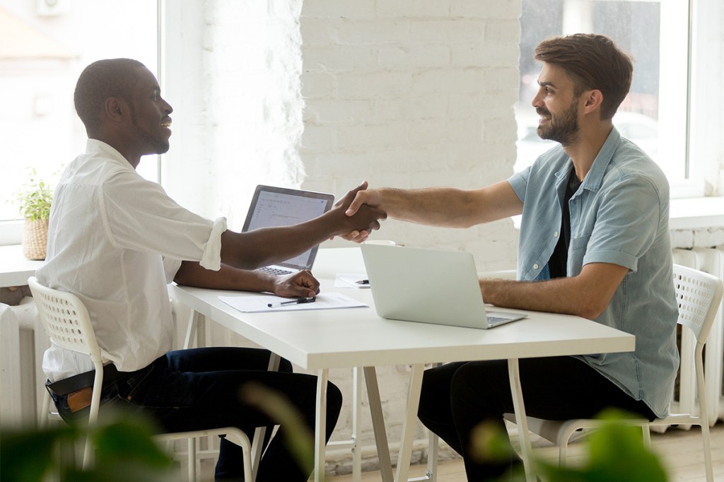 property manager shaking hand of a job candidate