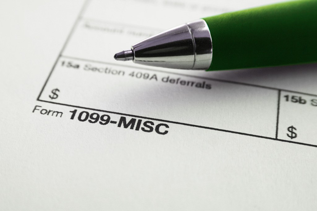 Form 1099-MISC with green pen on top