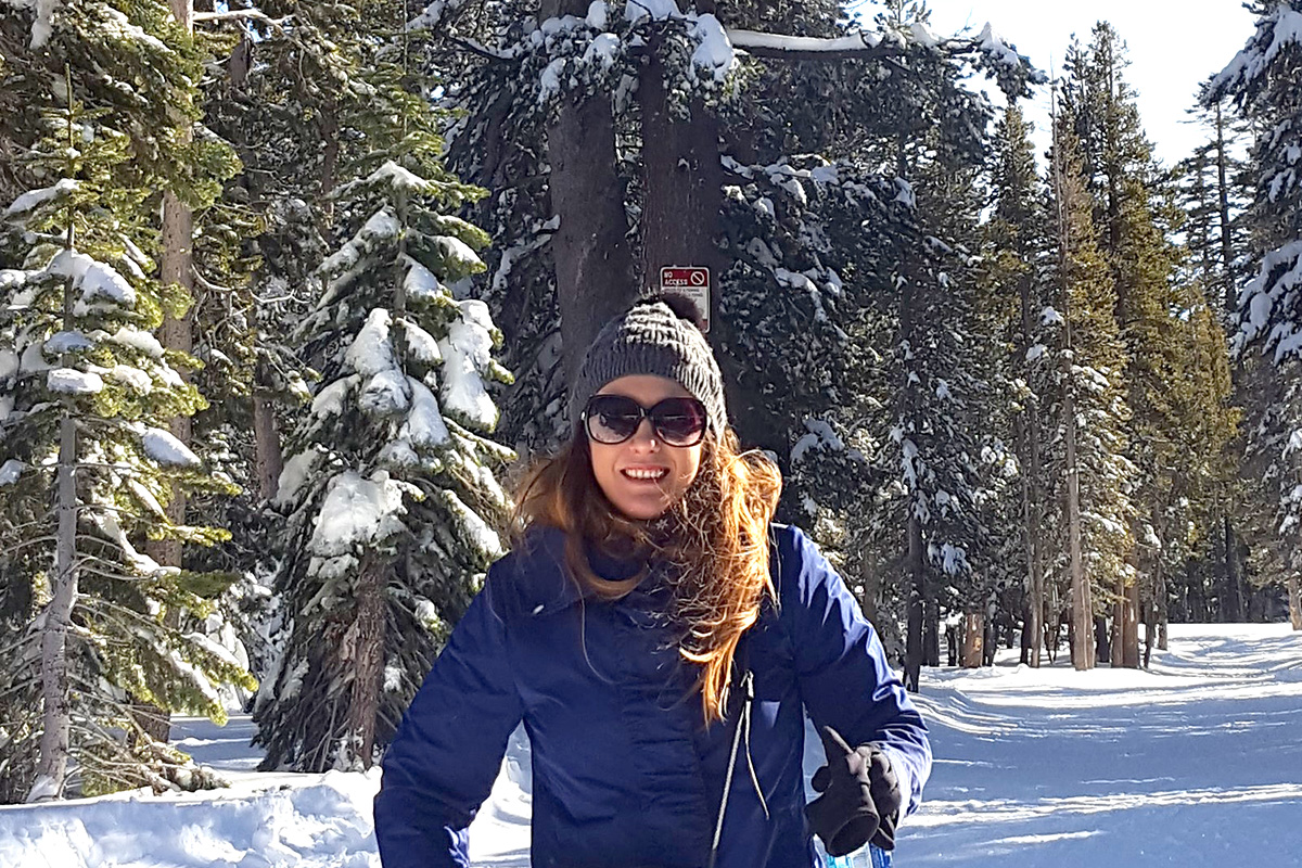 yardi breeze staff member anca iftime in the snow wearing a hat