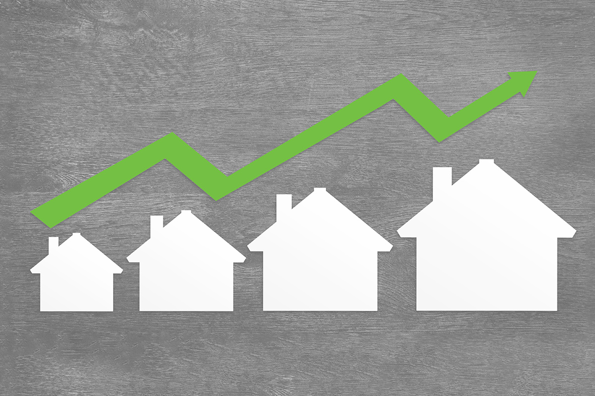 houses with green line representing rising national rent trends