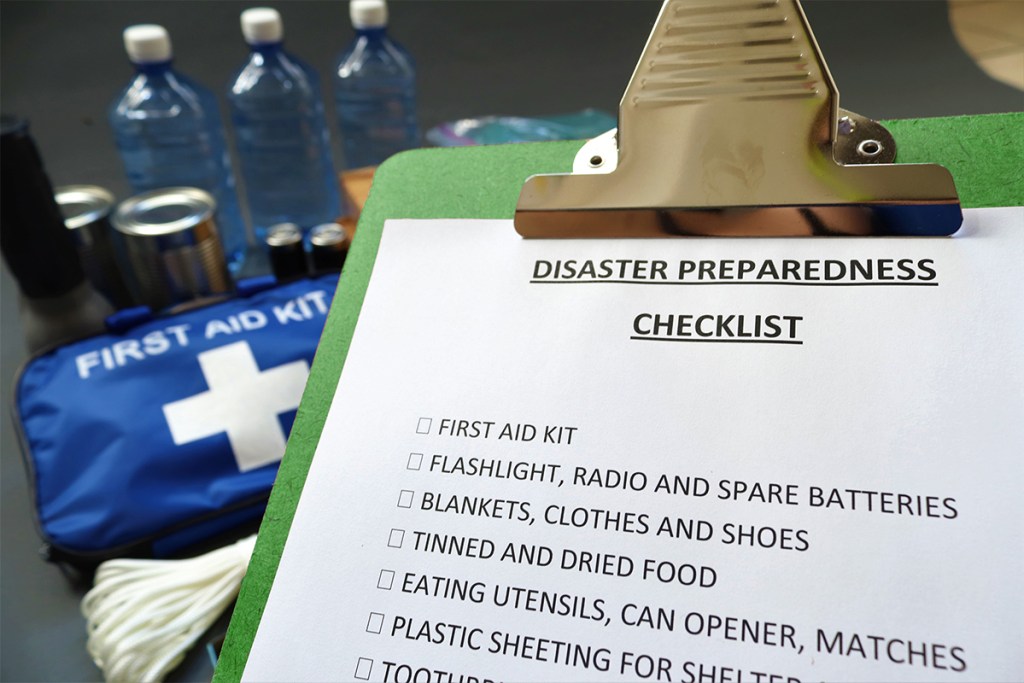 Property manager preparing for natual disasters with emergency kit