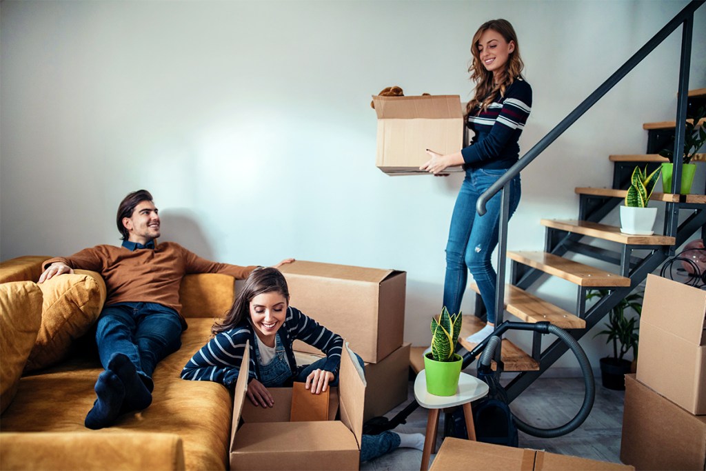 Co-living renters helping a roommate move in