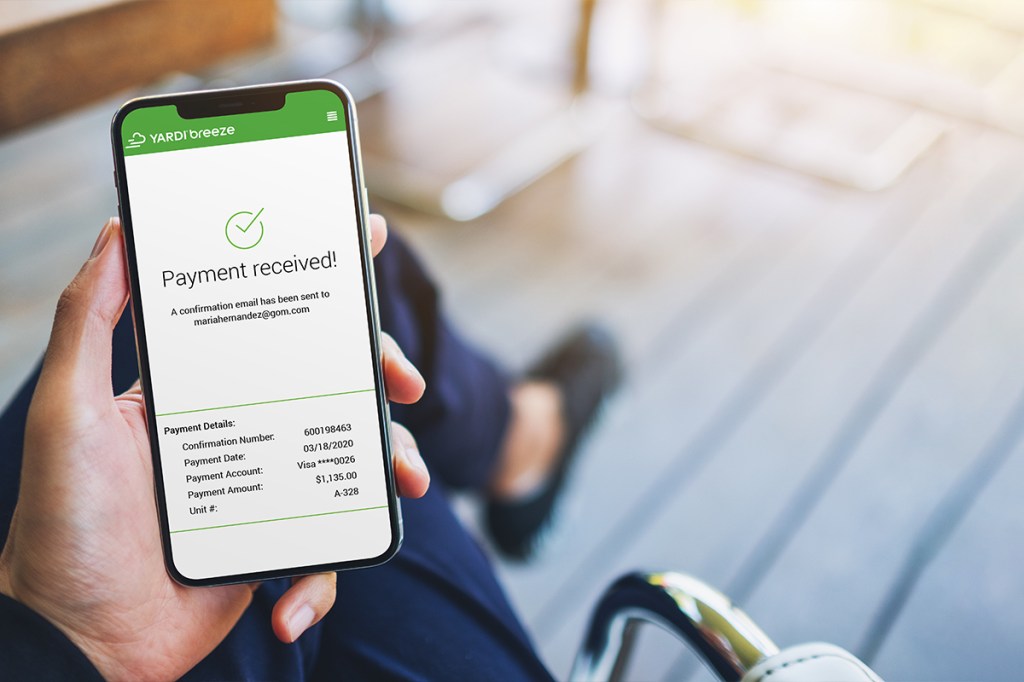 Phone showing Yardi Breeze screen