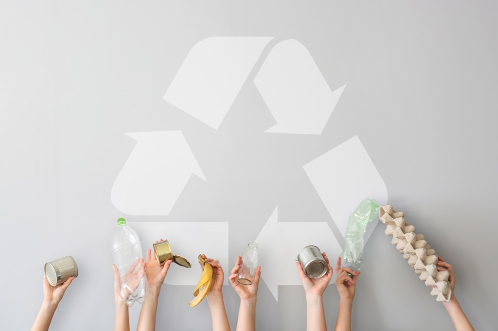 Residents reaching out to a recycling symbol