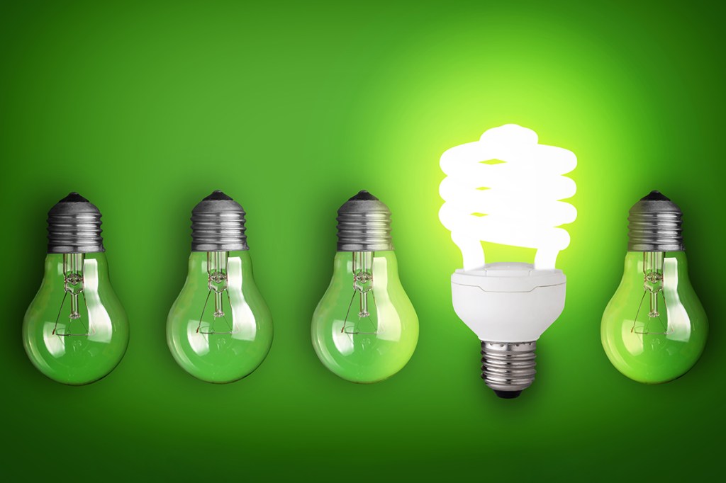 Five green lighbulbs with one lit up showing how one LED light can save energy at your properties