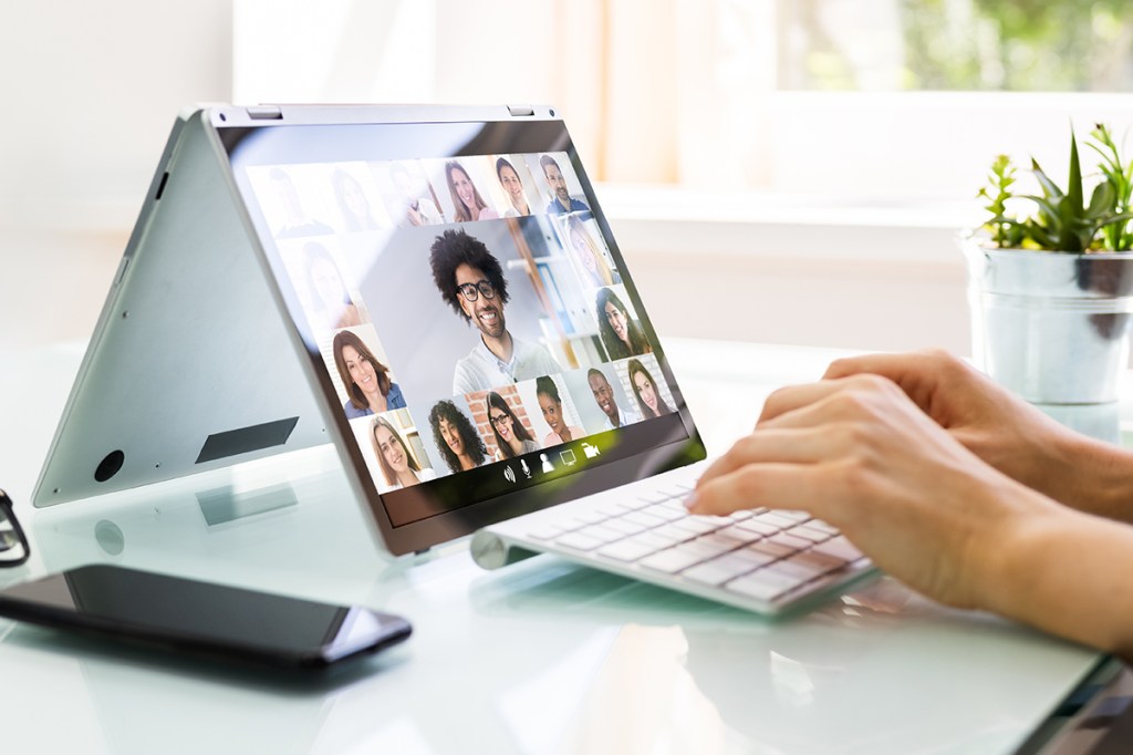 Property manager having a virtual meeting with residents on a tablet