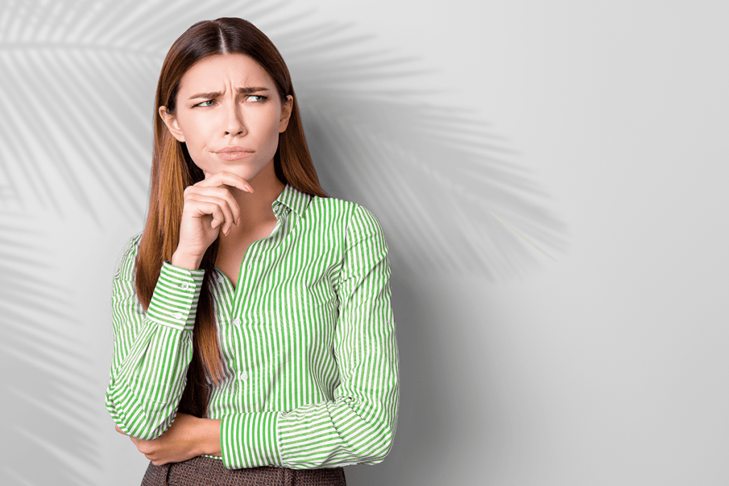 A woman looking skeptically at someone or something offscreen, likely because she sees some myths about property managers and the rental housing industry being projected around her