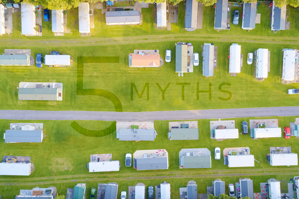 Manufactured housing neighborhood with "5 myths" mowed into the lawn