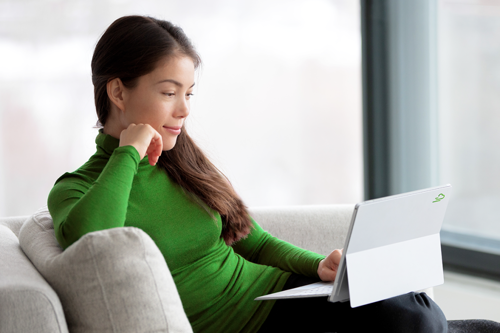 Young woman looking at her tablet for the best inventions for property managers