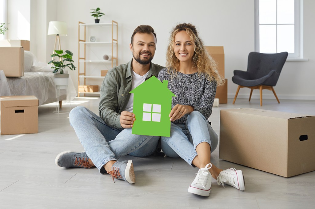Couple sitting in their house with text over them: How To Talk Renters Insurance