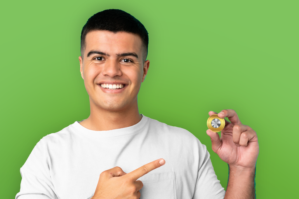 Gen Z or millennial male renter holding and pointing to a cryptocurrency coin, suggesting it's time to make leasing as easy as buying crypto