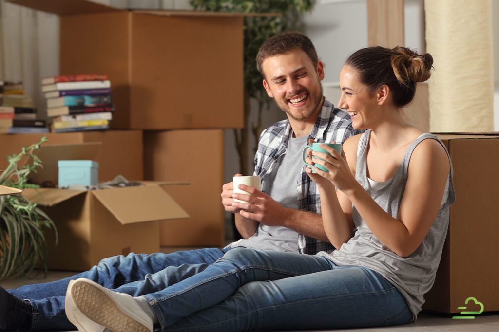 Happy couple sitting on couch