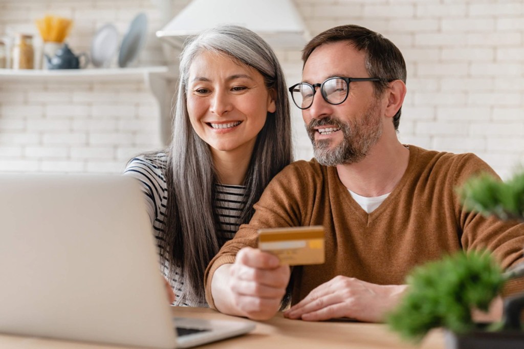 Man and woman looking at a self-service portal online