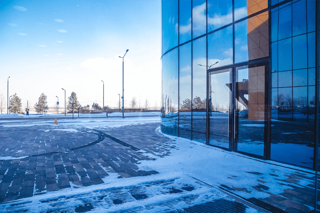 Snow on a building: make sure to winterize commercial properties