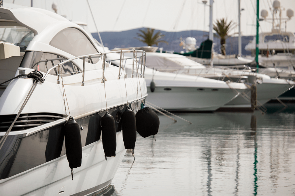 A boat docked at a harbor in need of an RV and boat storage facility