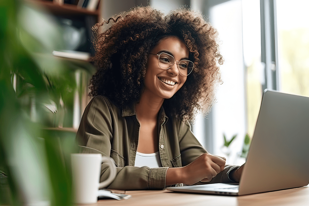 Woman on laptop looking at Yardi Breeze updates