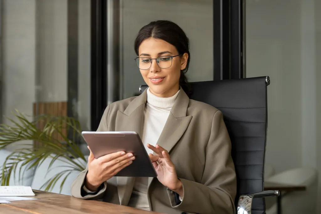Professional woman looking at her tablet