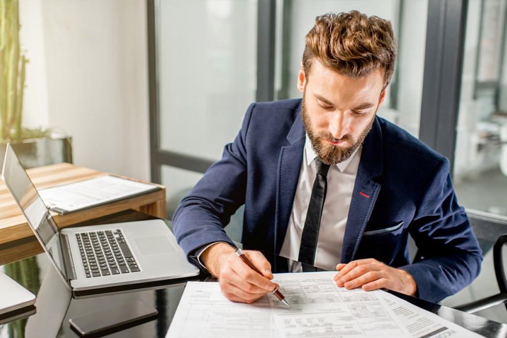 Man doing accounting at a desk