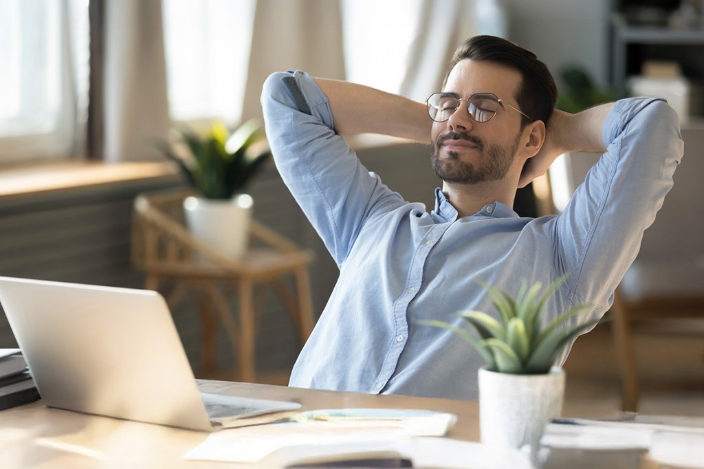 Man leaning back in chair in a relaxed position